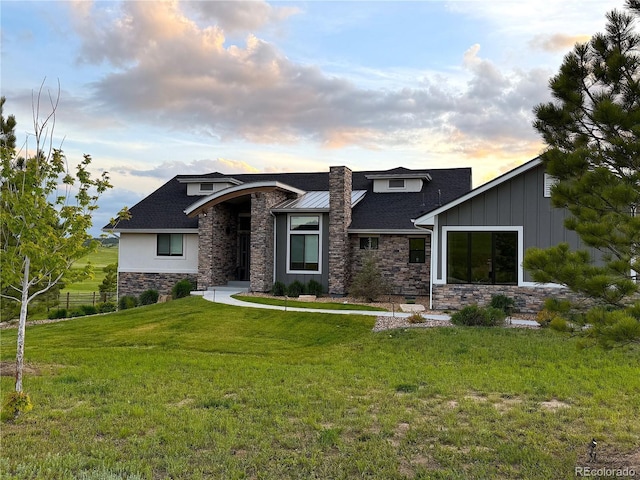 3125 Red Kit Rd, Franktown, CO 80116 - view of front of house with stone siding, a front lawn, and board and batten siding