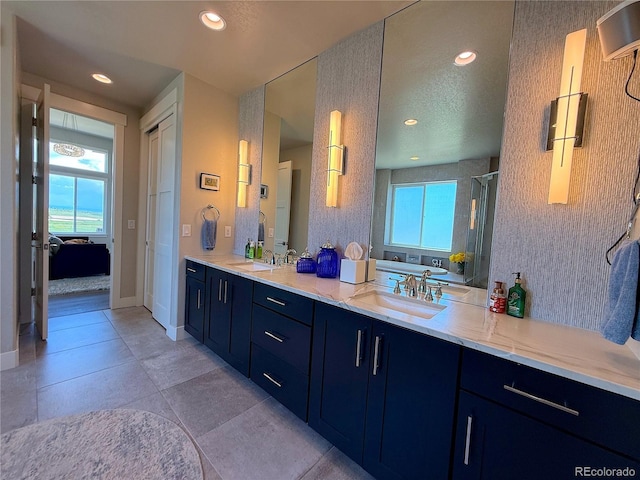 3125 Red Kit Rd, Franktown, CO 80116 - bathroom with double vanity, healthy amount of natural light, a shower stall, recessed lighting, and a tub