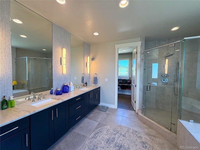 3125 Red Kit Rd, Franktown, CO 80116 - bathroom with double vanity, a stall shower, recessed lighting, and tile patterned floors