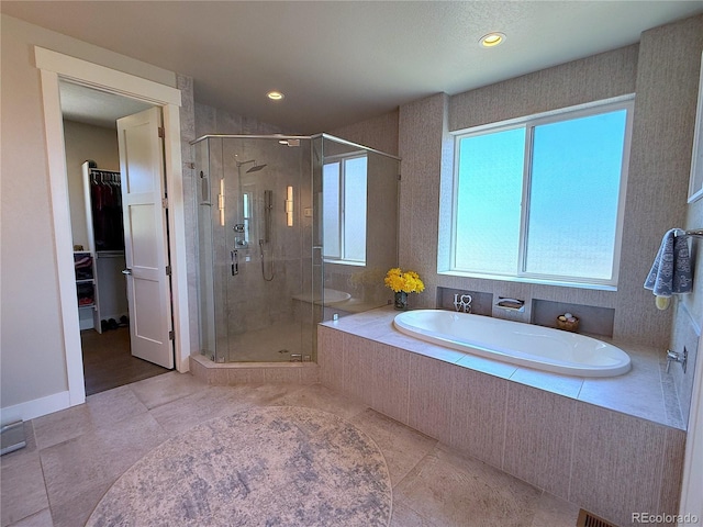 3125 Red Kit Rd, Franktown, CO 80116 - full bathroom with a stall shower, a bath, tile patterned floors, a spacious closet, and recessed lighting