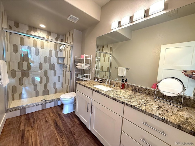 3125 Red Kit Rd, Franktown, CO 80116 - full bath featuring vanity, a shower stall, and wood finished floors