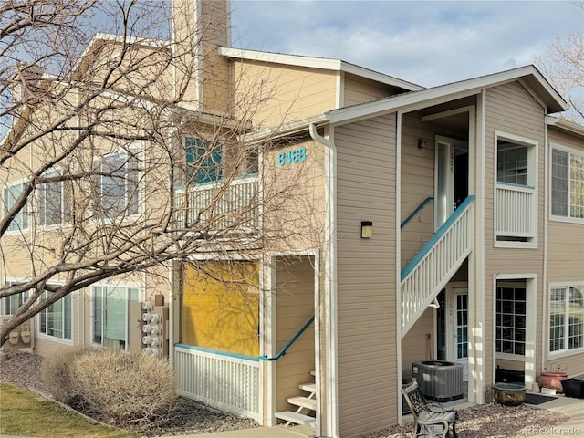 view of side of property featuring central air condition unit