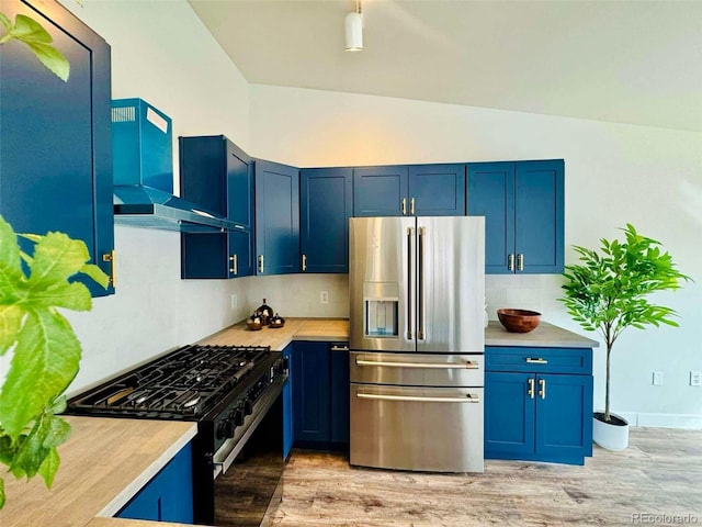 kitchen featuring backsplash, black range with gas stovetop, blue cabinetry, and stainless steel refrigerator with ice dispenser