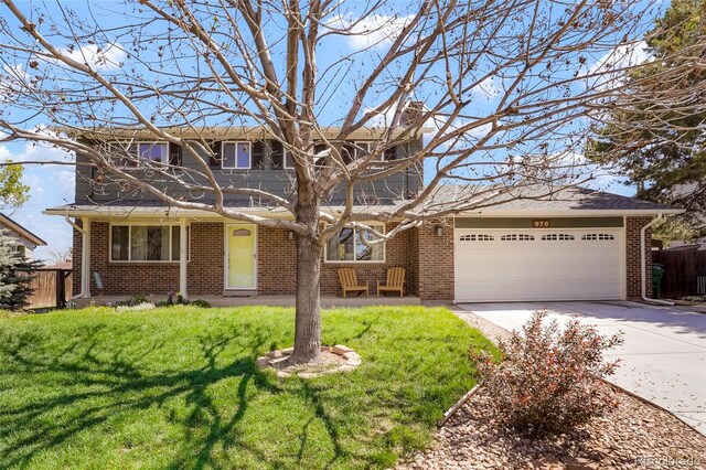 978 Mercury Cir, Lone Tree, CO 80124 - traditional-style house with concrete driveway, brick siding, and an attached garage