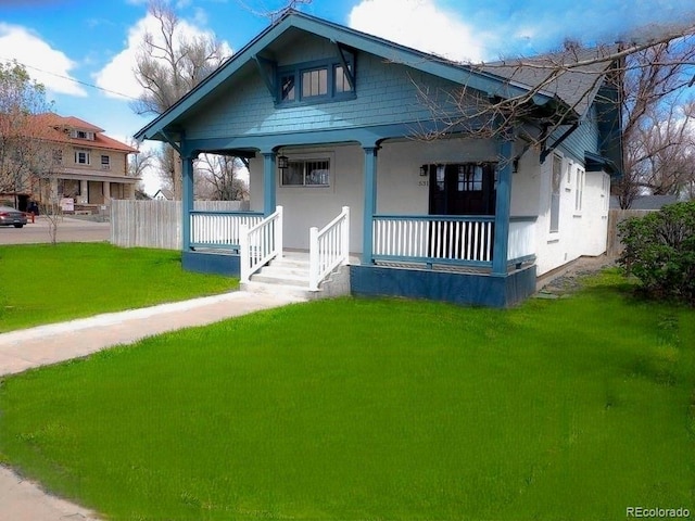 bungalow featuring a porch and a front yard