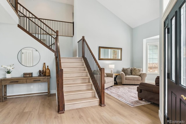 10029 Winterthur Ct, Highlands Ranch, CO 80129 - stairs with baseboards, high vaulted ceiling, and wood finished floors