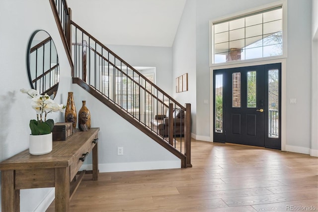 10029 Winterthur Ct, Highlands Ranch, CO 80129 - foyer with stairway, a towering ceiling, baseboards, and hardwood / wood-style floors