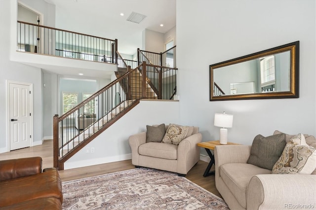 10029 Winterthur Ct, Highlands Ranch, CO 80129 - living area featuring stairs, a high ceiling, baseboards, and wood finished floors