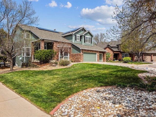 10029 Winterthur Ct, Highlands Ranch, CO 80129 - view of front of property with an attached garage, concrete driveway, a front lawn, solar panels, and brick siding