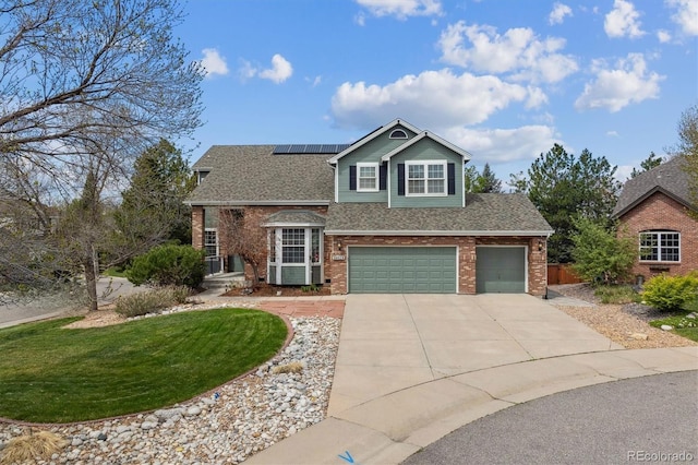 10029 Winterthur Ct, Highlands Ranch, CO 80129 - traditional home with an attached garage, roof mounted solar panels, concrete driveway, a front lawn, and brick siding