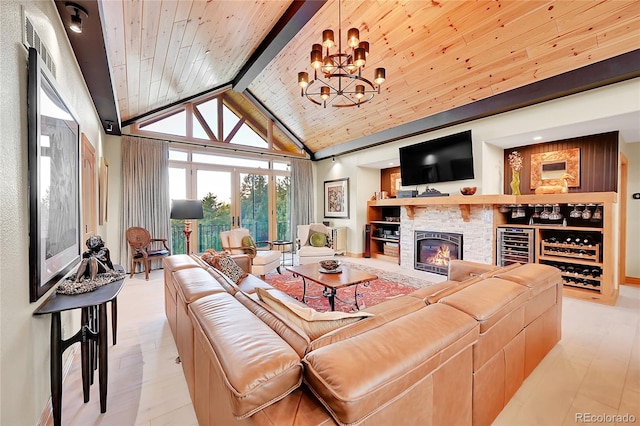 14564 Reserve Rd, Pine, CO 80470 - living area with wooden ceiling with exposed beams, high vaulted ceiling, a chandelier, and a stone fireplace