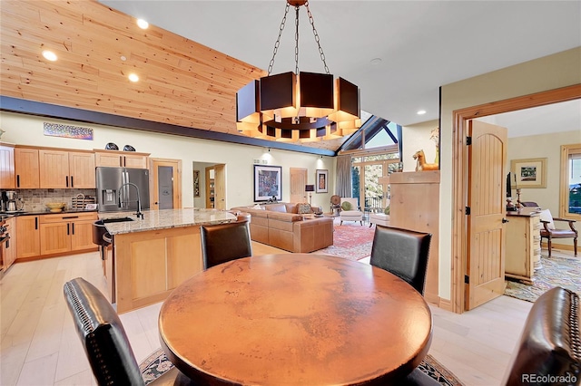 14564 Reserve Rd, Pine, CO 80470 - dining room featuring lofted ceiling, recessed lighting, and light wood finished floors