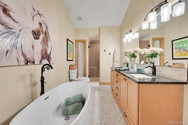 14564 Reserve Rd, Pine, CO 80470 - full bath with a shower stall, double vanity, a freestanding tub, tile patterned flooring, and toilet