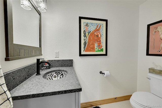 14564 Reserve Rd, Pine, CO 80470 - bathroom with toilet and vanity
