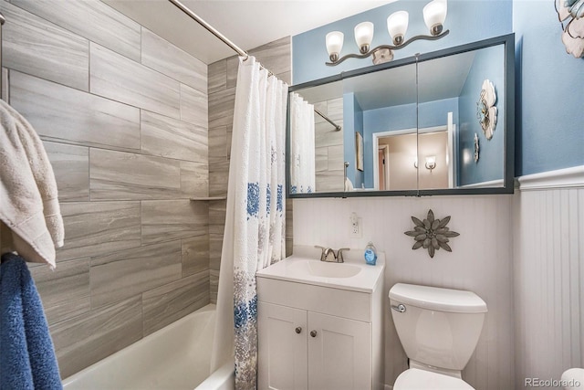 bathroom featuring vanity, shower / bath combo with shower curtain, and toilet