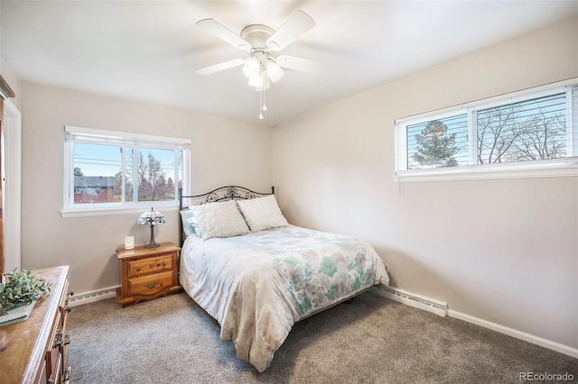 carpeted bedroom featuring baseboards, a baseboard heating unit, and multiple windows