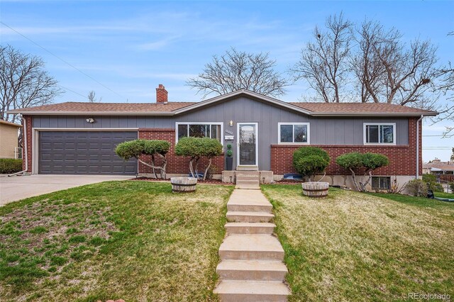 ranch-style home featuring an attached garage, brick siding, a front yard, a chimney, and concrete driveway