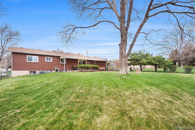 view of yard featuring fence and a patio