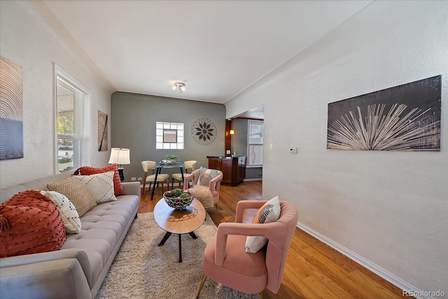 3420 Julian St, Denver, CO 80211 - living room featuring baseboards, a textured wall, and light wood finished floors