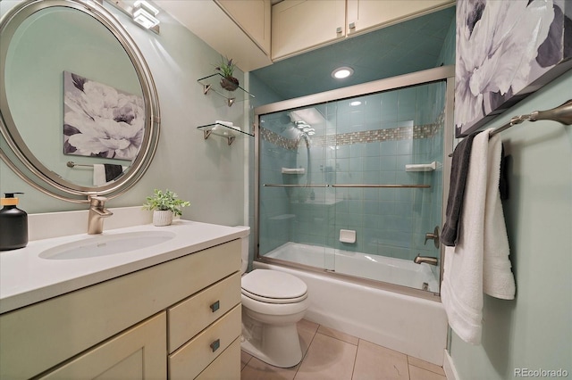 3420 Julian St, Denver, CO 80211 - bathroom with tile patterned floors, bath / shower combo with glass door, vanity, and toilet