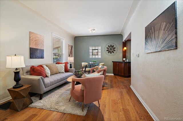 3420 Julian St, Denver, CO 80211 - living room featuring a textured wall and wood finished floors