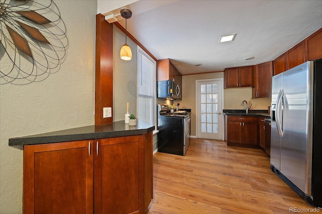 3420 Julian St, Denver, CO 80211 - kitchen with light wood finished floors, a textured wall, dark countertops, and stainless steel appliances
