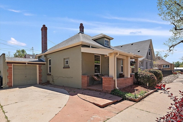 3420 Julian St, Denver, CO 80211 - view of front of house featuring a shingled roof, stucco siding, and driveway