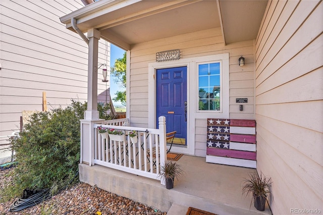 10521 Taylor Ave, Firestone, CO 80504 - doorway to property featuring covered porch