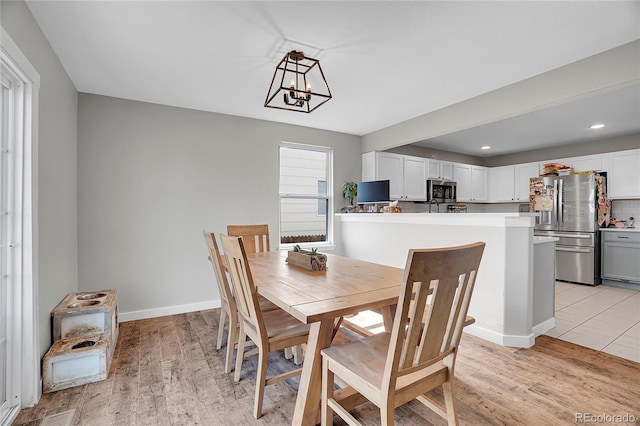 10521 Taylor Ave, Firestone, CO 80504 - dining space featuring a chandelier, light wood-style floors, and recessed lighting
