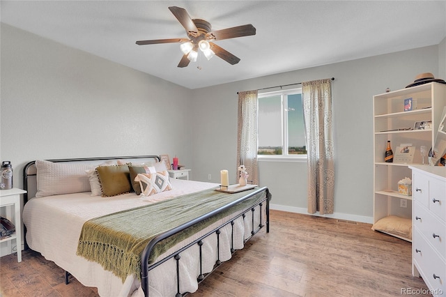 10521 Taylor Ave, Firestone, CO 80504 - bedroom with light wood finished floors and a ceiling fan