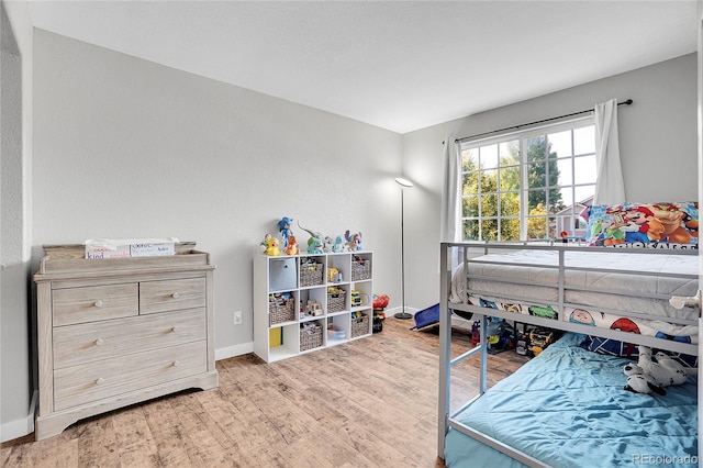 10521 Taylor Ave, Firestone, CO 80504 - bedroom with wood finished floors and baseboards
