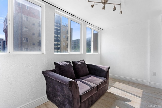 1121 Albion St Unit 210, Denver, CO 80220 - living area with baseboards and light wood finished floors