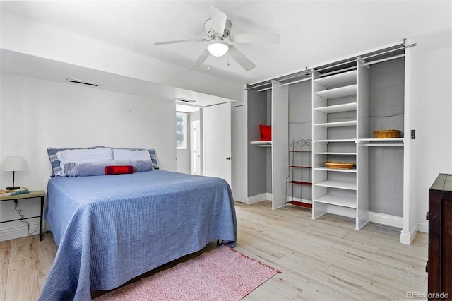1121 Albion St Unit 210, Denver, CO 80220 - bedroom with light wood-style flooring, baseboards, and a ceiling fan