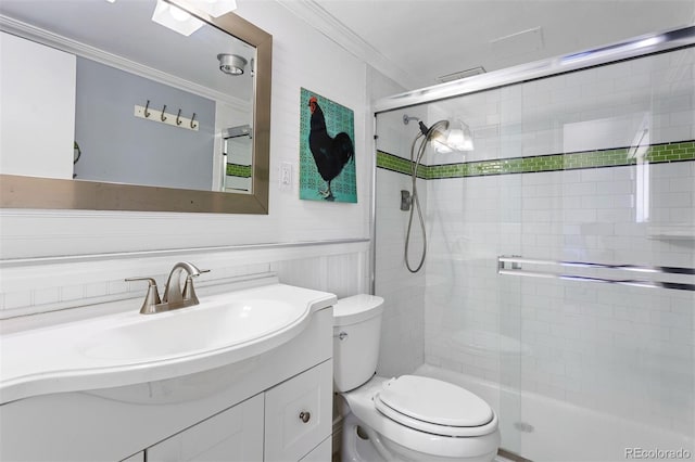 1121 Albion St Unit 210, Denver, CO 80220 - full bathroom with ornamental molding, toilet, a tile shower, and vanity