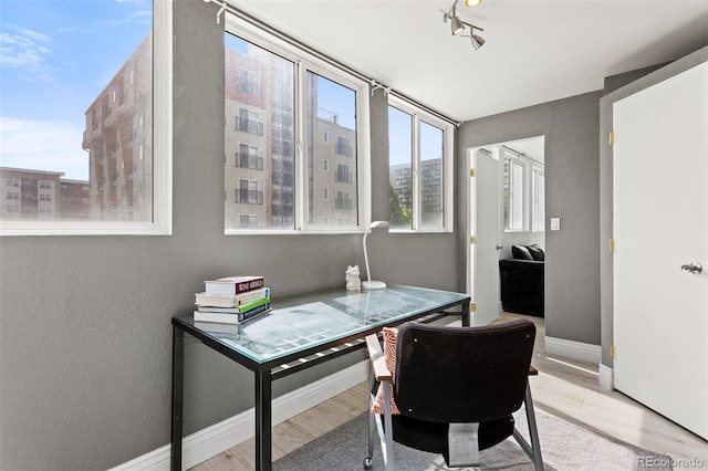 1121 Albion St Unit 210, Denver, CO 80220 - office area featuring wood finished floors and baseboards