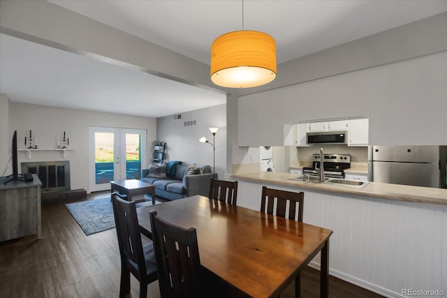 519 Wright St Unit 108, Lakewood, CO 80228 - dining space featuring dark wood-style floors and french doors