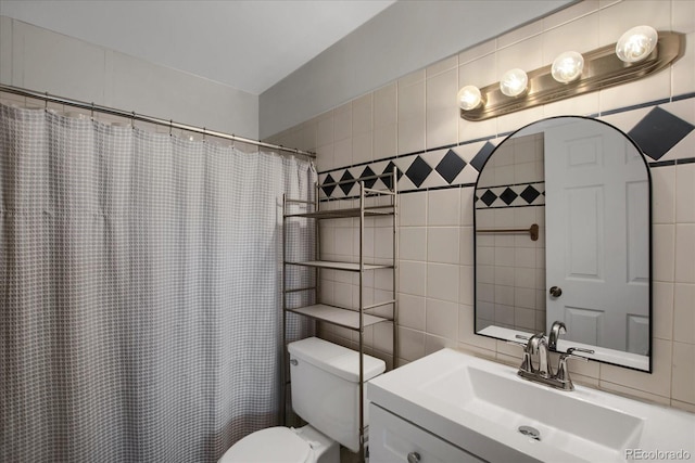 519 Wright St Unit 108, Lakewood, CO 80228 - bathroom featuring tile walls, vanity, toilet, tasteful backsplash, and a shower with shower curtain