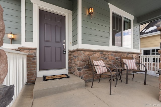 property entrance featuring a porch