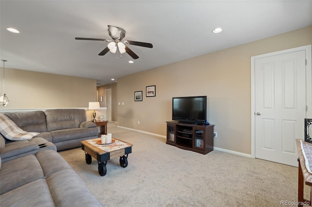 living room with light colored carpet and ceiling fan