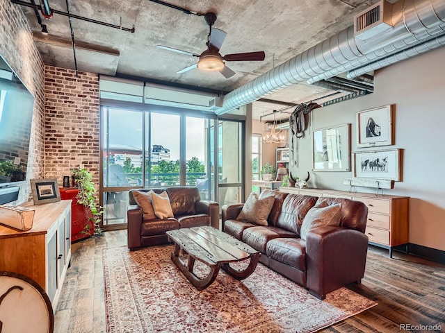 1401 Wewatta St Unit 308, Denver, CO 80202 - living room with hardwood / wood-style floors, a ceiling fan, and a chandelier