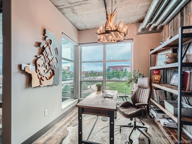 1401 Wewatta St Unit 308, Denver, CO 80202 - office with wood finished floors, a chandelier, and a city view