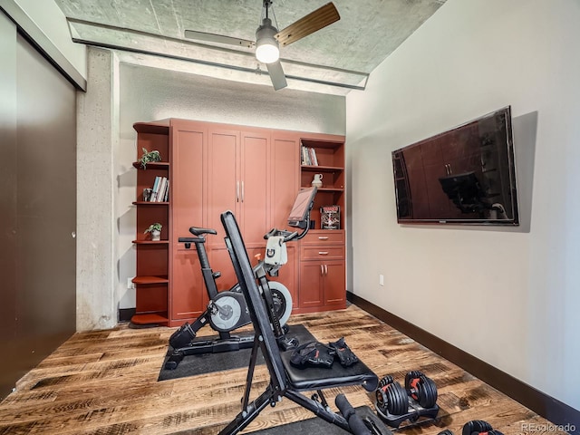 1401 Wewatta St Unit 308, Denver, CO 80202 - exercise area featuring a ceiling fan and light wood-style flooring