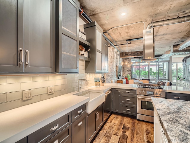 1401 Wewatta St Unit 308, Denver, CO 80202 - kitchen with stainless steel appliances, wood finished floors, tasteful backsplash, and open floor plan