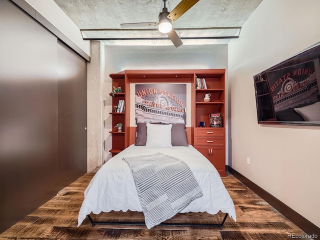 1401 Wewatta St Unit 308, Denver, CO 80202 - bedroom with a ceiling fan, dark wood-style flooring, and a closet