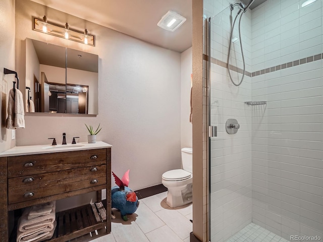 1401 Wewatta St Unit 308, Denver, CO 80202 - bathroom featuring a shower stall, vanity, and tile patterned floors