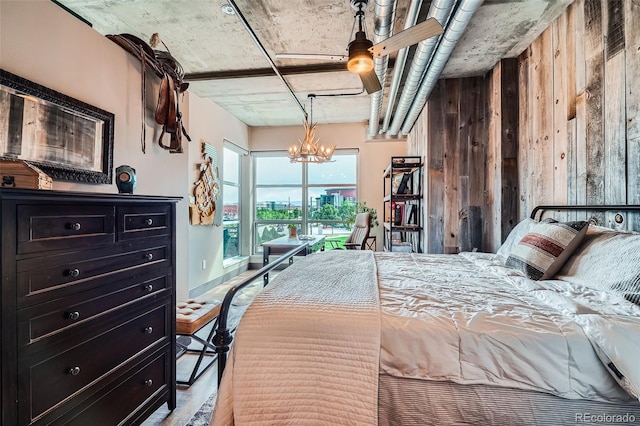 1401 Wewatta St Unit 308, Denver, CO 80202 - bedroom featuring a chandelier, wood walls, and light wood finished floors