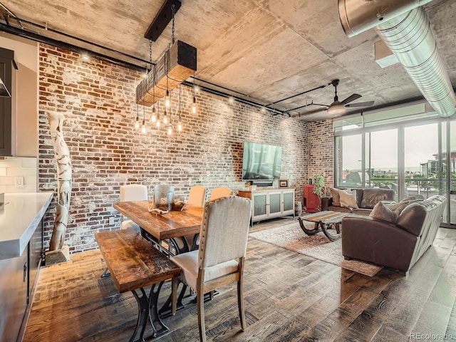 1401 Wewatta St Unit 308, Denver, CO 80202 - dining space featuring wood-type flooring, a ceiling fan, and brick wall