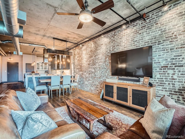1401 Wewatta St Unit 308, Denver, CO 80202 - living room with hardwood / wood-style floors, brick wall, and a ceiling fan