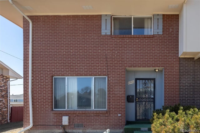 exterior space featuring crawl space and brick siding