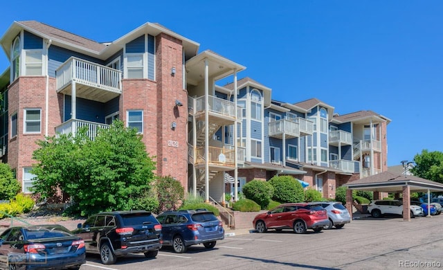 2428 W 82nd Pl Unit 3G, Westminster, CO 80031 - view of apartment building / complex with covered and uncovered parking